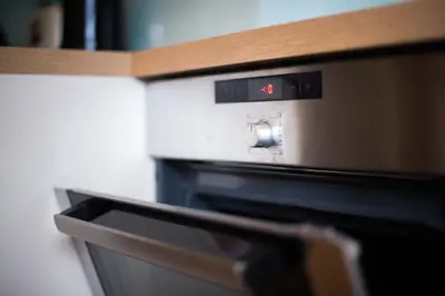 a microwave oven with the number on it at Apartma Ela in Bled
