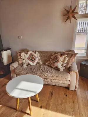 a living room with a couch and a table at Apartma 10th Mountain, Bovec in Bovec