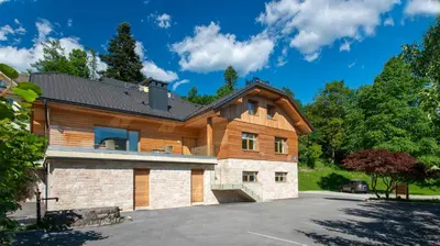 a log home with a gambrel roof at Vila Alpina in Bled