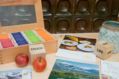 a table with a box of food and an apple at Vila Alpina in Bled