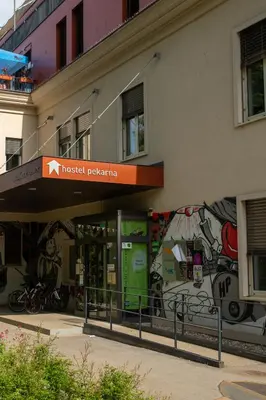 a building with graffiti on the side of it at Hostel Pekarna in Maribor