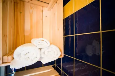 two towels on a shelf in a bathroom at Nature nook in Bled