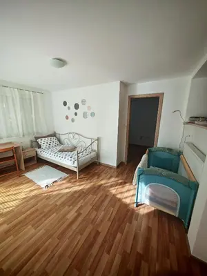a living room with a couch and a chair at Nauportus in Vrhnika