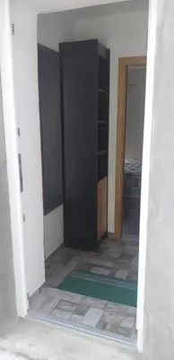 an empty room with a black cabinet in a room at Relax in Črni Kal 2 in Črni Kal