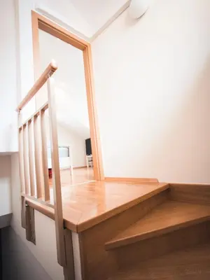 a staircase in a house with a glass window at Studio Kolman in Bled