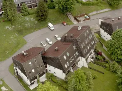 an aerial view of a building with a parking lot at Apartment Aly in Bovec