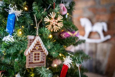 a christmas tree with christmas ornaments on it at Lovely Rustic House Pr' Čut in Žirovnica
