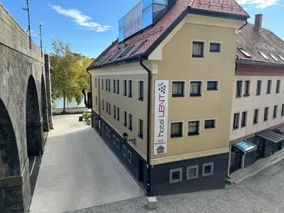 a building with a sign on the side of it at Hotel Lent in Maribor