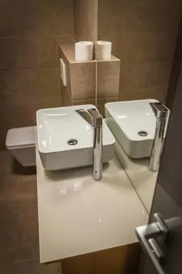 a bathroom with a white sink and a mirror at Villa Nena in Kranjska Gora