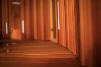 an empty corridor with orange curtains in a room at Villa Nena in Kranjska Gora