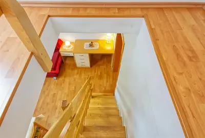 a small room with a desk and a table at Apartments Kovačič in Bohinj