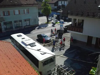 a bus parked on a street next to a building at Guesthouse Jersin in Logatec