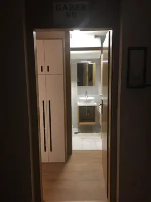 an open door to a bathroom with a sink at Apartma Rogla - Gaber 98 in Resnik