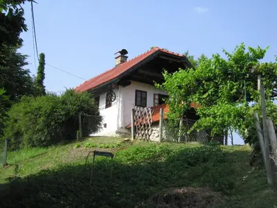 a small white house with a red roof at Holiday Home Carovina in Paradiž
