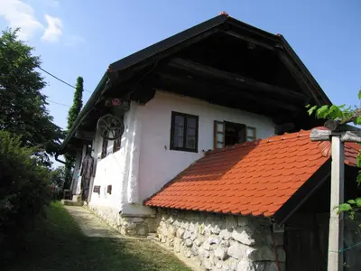 a white house with an orange roof at Holiday Home Carovina in Paradiž
