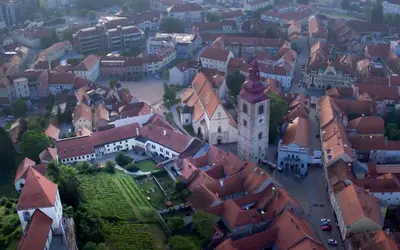 an aerial view of a town with a castle at Sobe Proštija in Ptuj