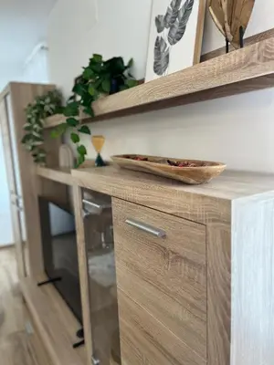 a wooden cabinet with a bowl on top of it at Apartma Kemper in Bovec