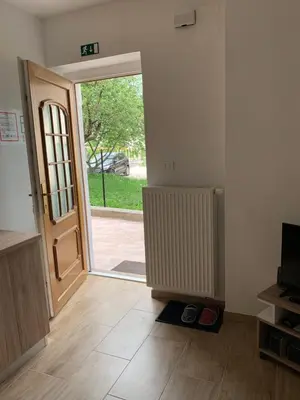 an empty room with an open door with a porch at Apartma Kemper in Bovec