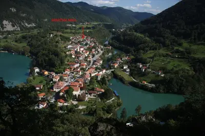 an aerial view of a small town in the middle of a lake at Apartma Mika in Most na Soči