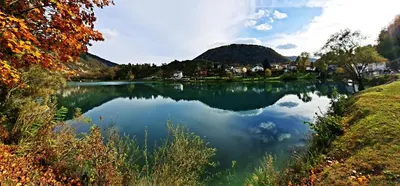 a view of a lake with mountains in the background at Apartma Mika in Most na Soči
