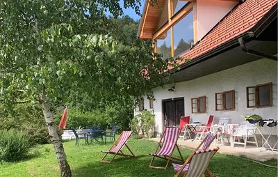 a group of chairs sitting in the yard of a house at 4 Bedroom Amazing Home In Vrhnika in Vrhnika