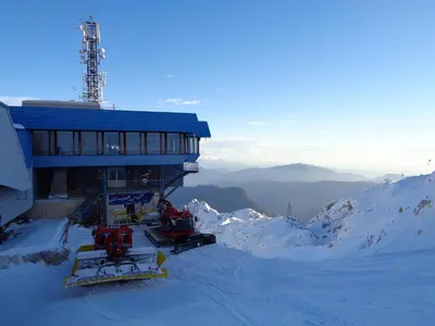 a ski lodge on top of a snow covered mountain at Apartment Japka in Bovec