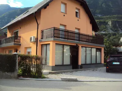 a house with a balcony on the side of it at Apartment Japka in Bovec