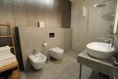 a bathroom with a sink and a toilet and a sink at Argo Apartments in Ljubljana