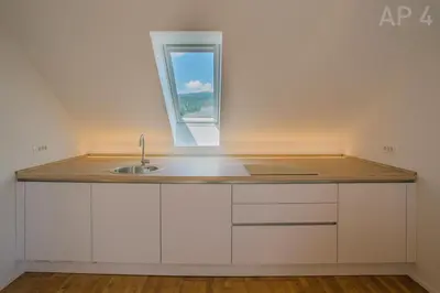 a kitchen with a sink and a window at Apartments Perla in Zgornje Gorje