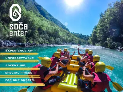 a group of people on a raft on a river at Holiday house Pr Robč in Bovec