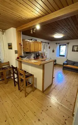a kitchen with a large island in a room at Holiday house Pr Robč in Bovec