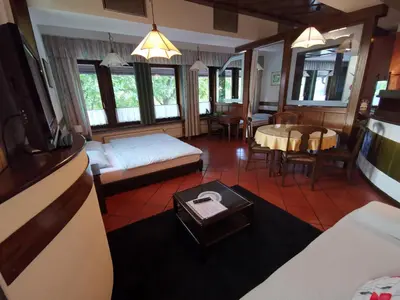 a living room with a couch and a table at Apartmaji Mak in Jesenice