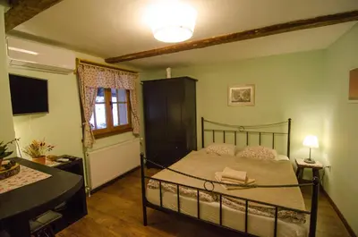 a bedroom with a bed in a room at pr' Drašlerju in Dovje