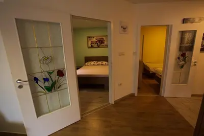 a room with a bedroom with a bed and a window at Bled Honey Bee Apartment in Bled