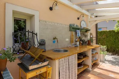 a kitchen with a counter with a sink in it at Apartma Summer Garden in Bled
