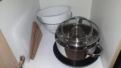 a trash can in the corner of a kitchen at Tabor - Apartments Rozmanova Street in Ljubljana
