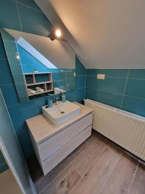a bathroom with a sink and a bath tub at Apartment Ravnik Brod 13 in Bohinj