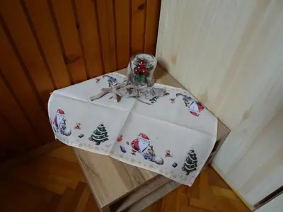 a table with a christmas table cloth on it at Apartment Tjaša in Radovljica