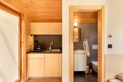 a small kitchen with a sink and a counter at Glamping Mountain Fairy Tale in Bistrica pri Tržiču
