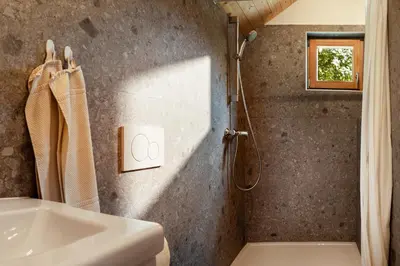 a bathroom with a shower and a sink at Glamping Mountain Fairy Tale in Bistrica pri Tržiču