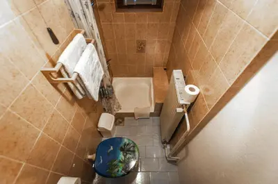 an overhead view of a bathroom with a toilet and sink at Apartment Ticar in Bohinj