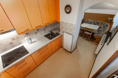 an overhead view of a kitchen with orange cabinets at Apartment Ticar in Bohinj