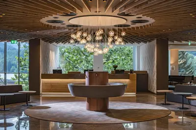 a large lobby with a large chandelier at Hotel Park - Sava Hotels & Resorts in Bled