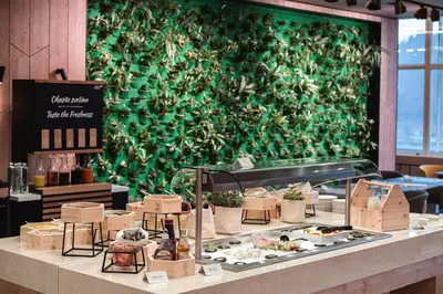 a display case with plants on a wall at Rikli Balance Hotel – Sava Hotels & Resorts in Bled