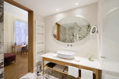 a bathroom with a sink and a mirror at Grand Hotel Union Eurostars in Ljubljana