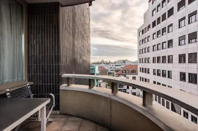 a balcony with a view of a building at Eurostars uHOTEL in Ljubljana