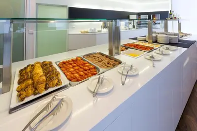 a buffet line with many different types of food at M Hotel in Ljubljana