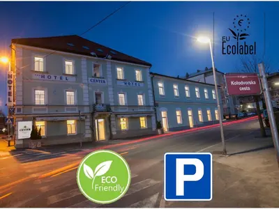 a building on the side of a street at night at ECO Hotel Center Postojna in Postojna