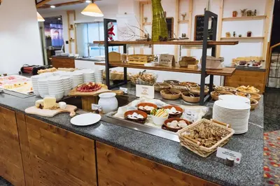 a buffet line with many different types of food at Rogla – Hotel Rogla in Resnik