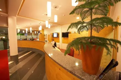 a potted plant sitting on a counter in a restaurant at Rogla – Hotel Rogla in Resnik